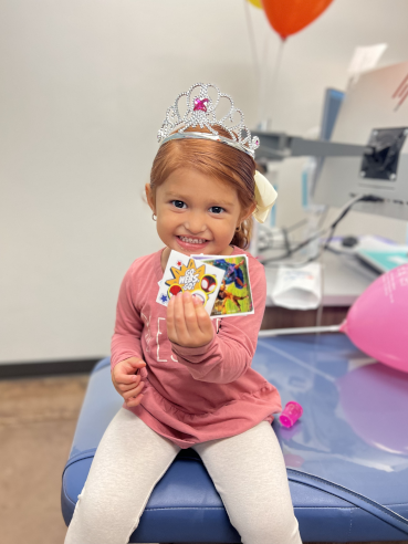 Happy Horn Lake Patient with Prizes